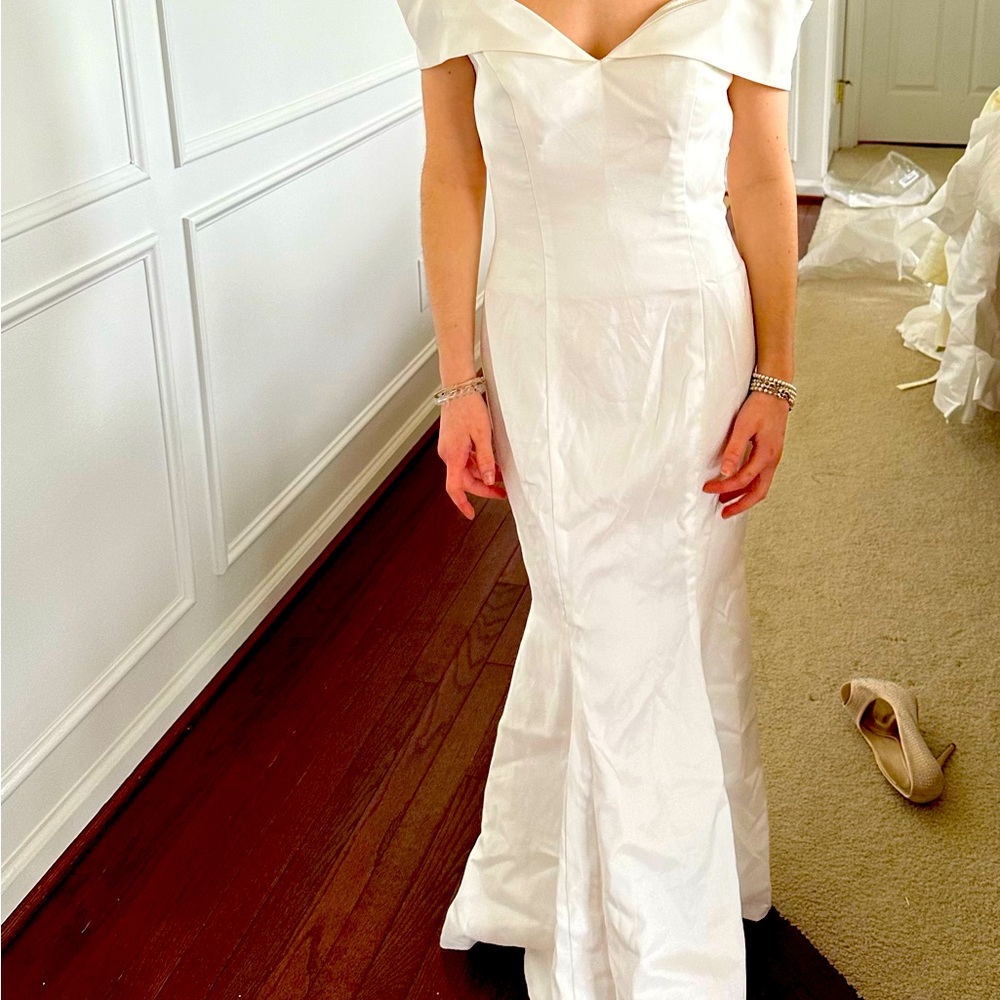 Off the shoulder white satin gown. Simply elegant.
